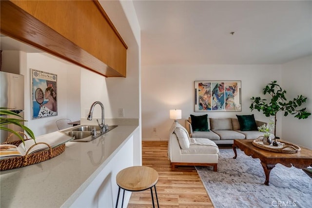 living area featuring light wood-style flooring