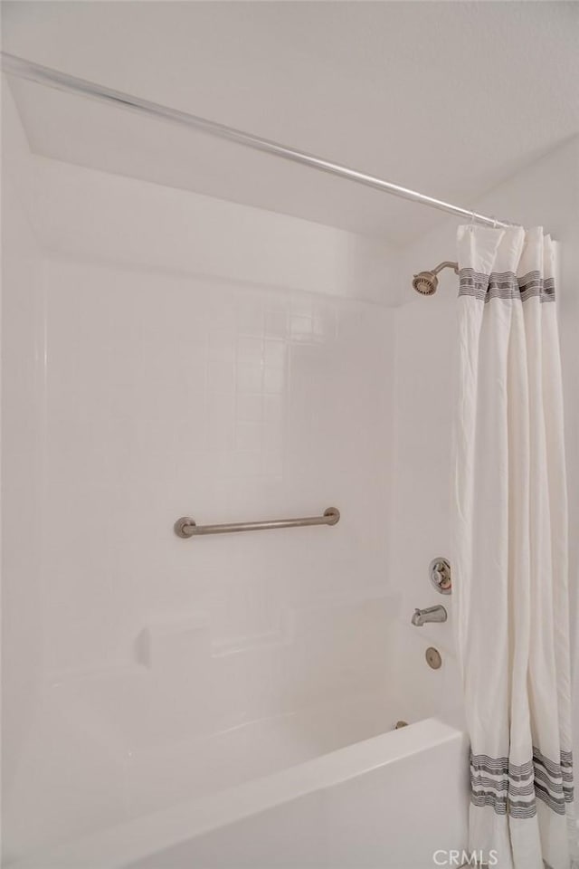 full bath featuring shower / bath combo with shower curtain