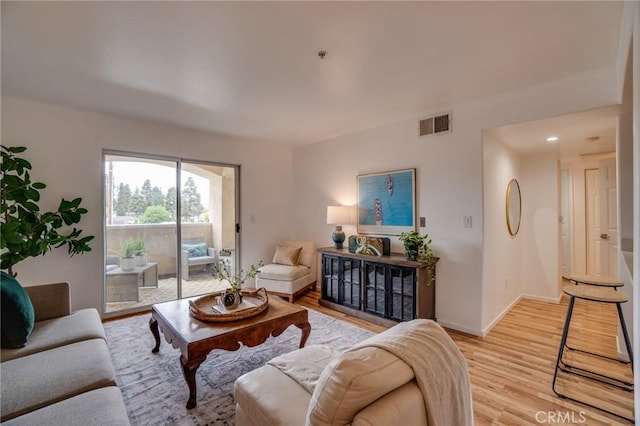 living room with light wood-style floors and baseboards