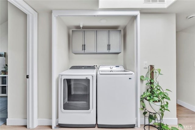 166 Alta St Unit B, Arcadia, CA 91006 - laundry room with separate washer and dryer, cabinet space, baseboards, and light wood-type flooring