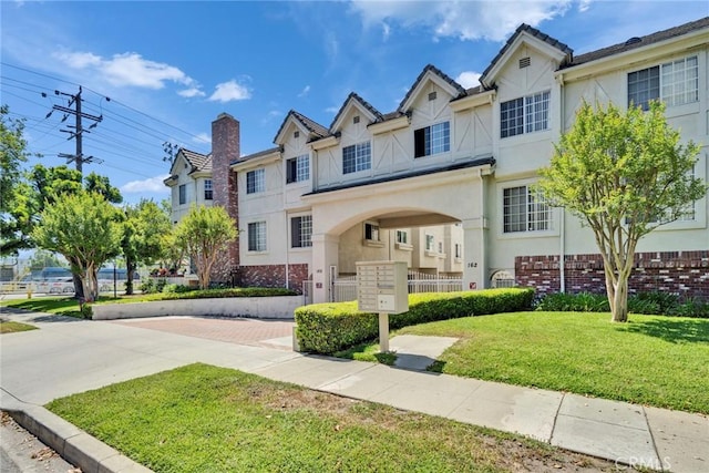 166 Alta St Unit B, Arcadia, CA 91006 - view of property featuring stucco siding, brick siding, and a front lawn