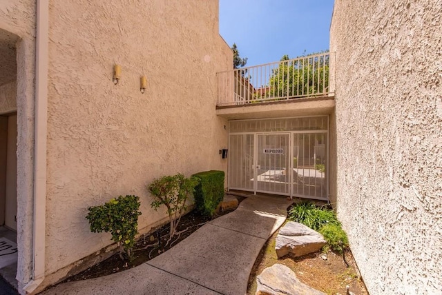 3306 Darby St Unit 402, Simi Valley, CA 93063 - property entrance with a balcony and stucco siding
