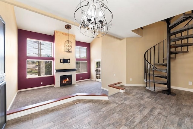 3306 Darby St Unit 402, Simi Valley, CA 93063 - unfurnished living room featuring stairs, wood finished floors, healthy amount of natural light, and baseboards