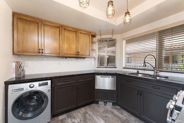 3306 Darby St Unit 402, Simi Valley, CA 93063 - washroom with washer / clothes dryer, healthy amount of natural light, and light wood-type flooring