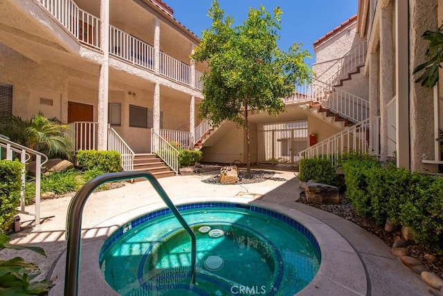 3306 Darby St Unit 402, Simi Valley, CA 93063 - view of pool with stairway and an in-ground hot tub
