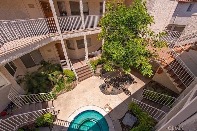 3306 Darby St Unit 402, Simi Valley, CA 93063 - view of home's community with a jacuzzi, stairs, and a patio area