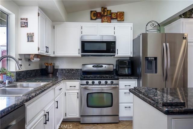 18993 Janisse Ln, Lake Elsinore, CA 92530 - kitchen featuring stainless steel appliances, a sink, white cabinets, and lofted ceiling