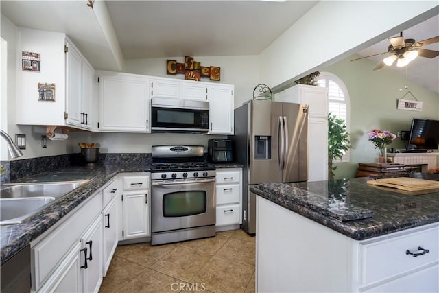 18993 Janisse Ln, Lake Elsinore, CA 92530 - kitchen featuring stainless steel appliances, vaulted ceiling, a sink, ceiling fan, and white cabinets