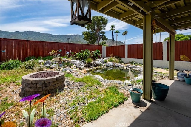 18993 Janisse Ln, Lake Elsinore, CA 92530 - fenced backyard featuring a small pond and a mountain view