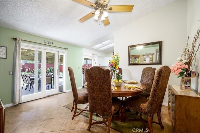 18993 Janisse Ln, Lake Elsinore, CA 92530 - dining area with light tile patterned floors, a textured ceiling, a ceiling fan, and baseboards