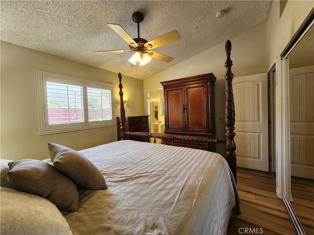 18993 Janisse Ln, Lake Elsinore, CA 92530 - bedroom with wood finished floors, lofted ceiling, a textured ceiling, and a ceiling fan