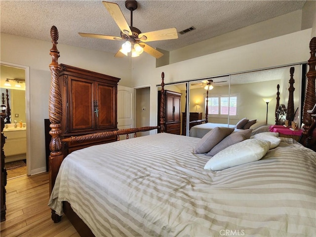 18993 Janisse Ln, Lake Elsinore, CA 92530 - bedroom featuring light wood-style flooring, a textured ceiling, and ceiling fan