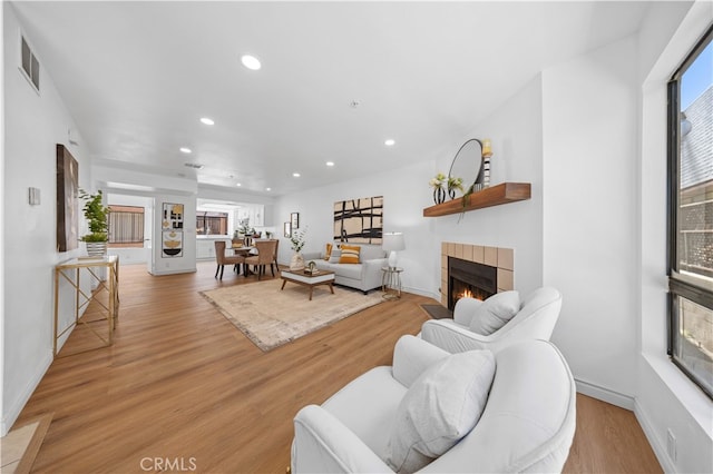 105 S Marguerita Ave Unit A, Alhambra, CA 91801 - living area with a fireplace, recessed lighting, plenty of natural light, and light wood-type flooring