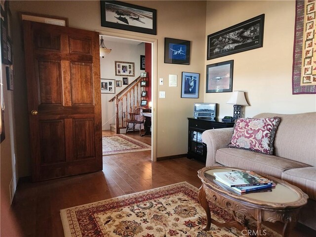1014 Dusty Rd, Frazier Park, CA 93225 - living room featuring dark wood-style floors, stairway, and baseboards