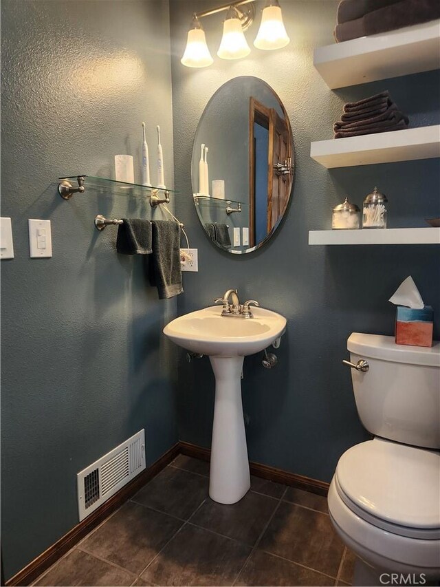 1014 Dusty Rd, Frazier Park, CA 93225 - half bathroom featuring tile patterned flooring, toilet, and baseboards