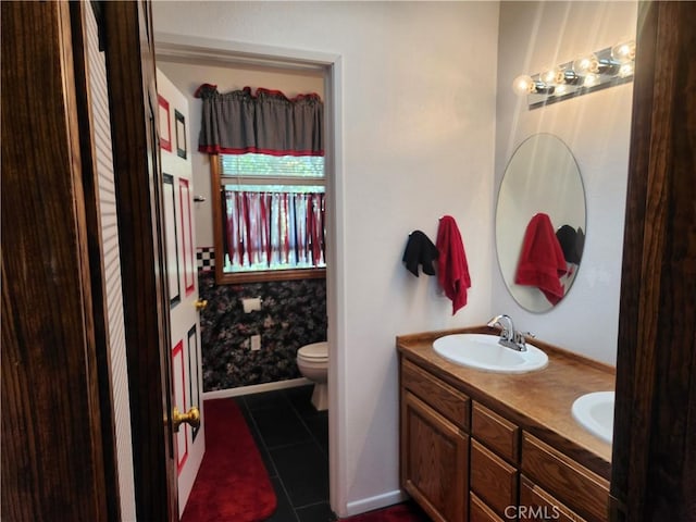 1014 Dusty Rd, Frazier Park, CA 93225 - bathroom with tile patterned floors, double vanity, toilet, and baseboards