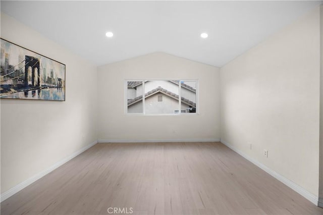 2407 Galisteo St, Corona, CA 92882 - empty room with wood finished floors, vaulted ceiling, baseboards, and recessed lighting