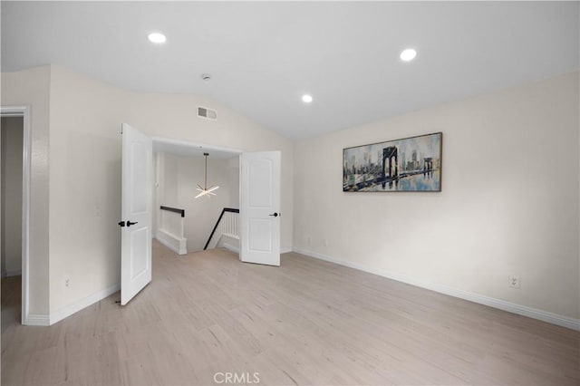 2407 Galisteo St, Corona, CA 92882 - unfurnished bedroom with light wood-type flooring, vaulted ceiling, baseboards, and recessed lighting