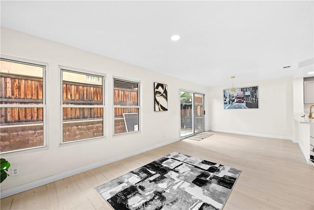 2407 Galisteo St, Corona, CA 92882 - workout room featuring light wood-type flooring, baseboards, and recessed lighting