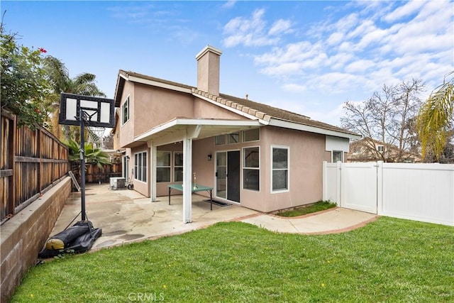 2407 Galisteo St, Corona, CA 92882 - back of house with a chimney, stucco siding, and a patio area