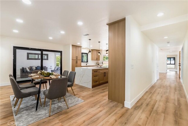 1216 W River Ln, Santa Ana, CA 92706 - dining area featuring light wood-style floors, baseboards, and recessed lighting