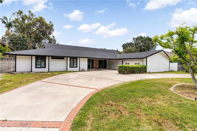 1216 W River Ln, Santa Ana, CA 92706 - view of front of house featuring driveway, stucco siding, and a shingled roof