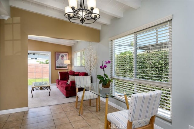 dining space featuring a chandelier, baseboards, light carpet, and light tile patterned flooring