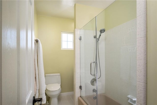 full bath with toilet, enclosed tub / shower combo, baseboards, and tile patterned floors