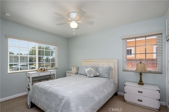 bedroom featuring carpet flooring, baseboards, and ceiling fan