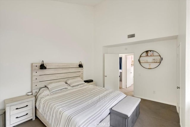 13607 Chaparral Trl, Yucaipa, CA 92399 - bedroom featuring dark colored carpet, a high ceiling, and baseboards