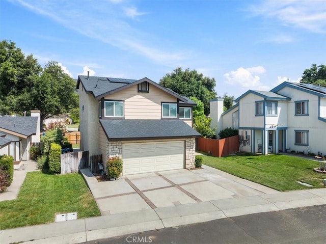 13607 Chaparral Trl, Yucaipa, CA 92399 - traditional-style house with roof mounted solar panels, concrete driveway, an attached garage, and a shingled roof