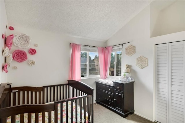 13607 Chaparral Trl, Yucaipa, CA 92399 - bedroom with a textured ceiling, light colored carpet, vaulted ceiling, and a nursery area