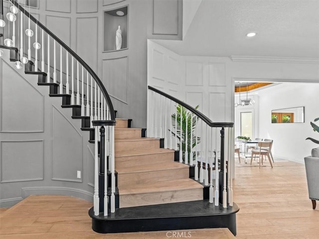 5505 Paseo Joaquin, Yorba Linda, CA 92886 - stairs featuring a decorative wall, ornamental molding, wood finished floors, and recessed lighting