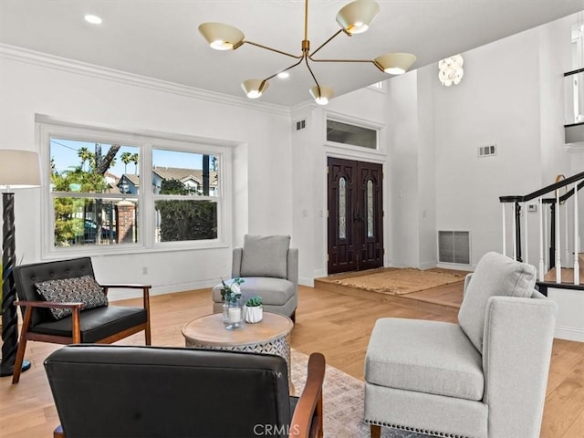 5505 Paseo Joaquin, Yorba Linda, CA 92886 - living area with ornamental molding, light wood-type flooring, stairway, and a chandelier