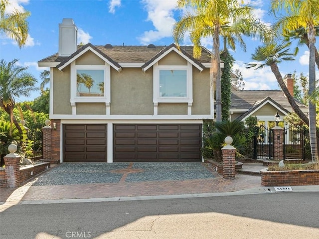5505 Paseo Joaquin, Yorba Linda, CA 92886 - view of front of house with decorative driveway, a garage, a chimney, and stucco siding