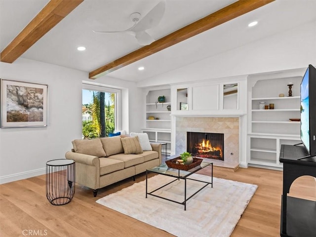 5505 Paseo Joaquin, Yorba Linda, CA 92886 - living room featuring baseboards, a tiled fireplace, recessed lighting, light wood-style flooring, and built in shelves
