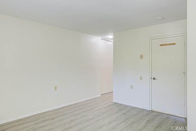 3336 Punta Alta Unit 2F, Laguna Woods, CA 92637 - empty room with light wood finished floors and baseboards