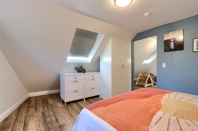5192 Oak Rd, Mariposa, CA 95345 - bedroom with wood finished floors, lofted ceiling, baseboards, and a skylight
