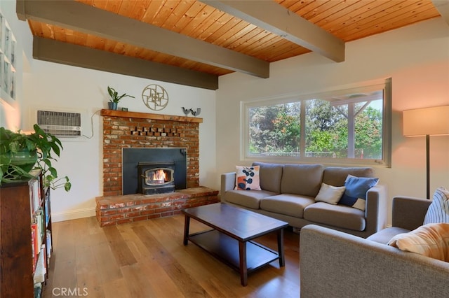 5192 Oak Rd, Mariposa, CA 95345 - living area with hardwood / wood-style flooring, beamed ceiling, a wall mounted air conditioner, baseboards, and wooden ceiling