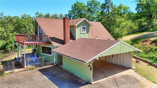 5192 Oak Rd, Mariposa, CA 95345 - back of property with driveway, a chimney, a carport, fence, and roof with shingles