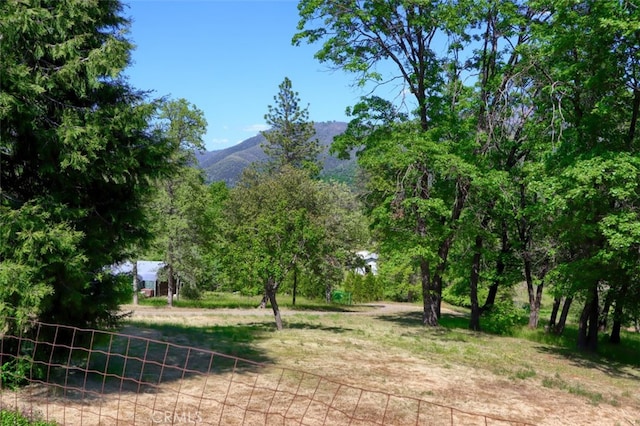 5192 Oak Rd, Mariposa, CA 95345 - view of yard featuring a mountain view and fence