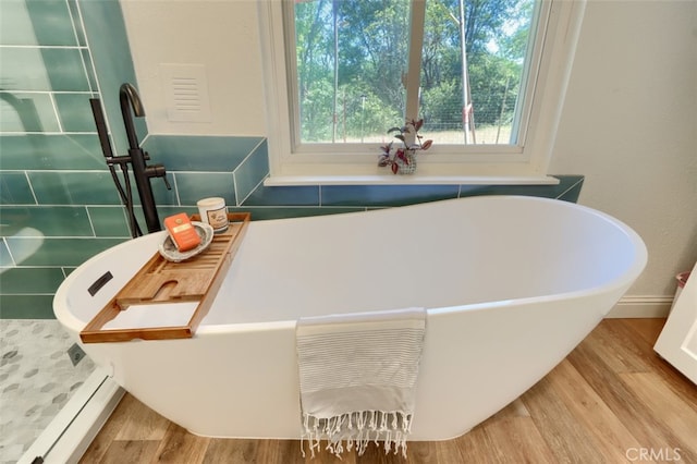 5192 Oak Rd, Mariposa, CA 95345 - bathroom featuring wood finished floors and a soaking tub