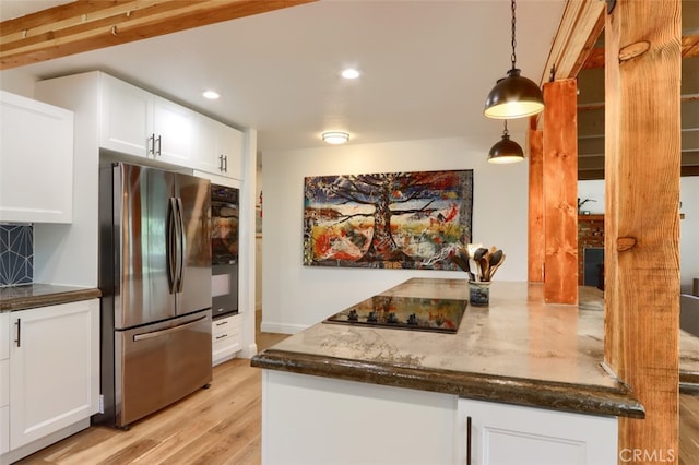 5192 Oak Rd, Mariposa, CA 95345 - kitchen featuring black appliances, light wood-style floors, recessed lighting, white cabinets, and dark stone countertops