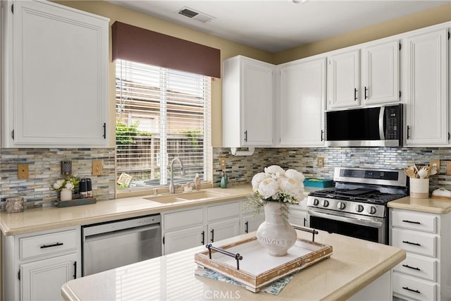 23725 Scarlet Oak Dr, Murrieta, CA 92562 - kitchen featuring appliances with stainless steel finishes, a sink, and white cabinetry