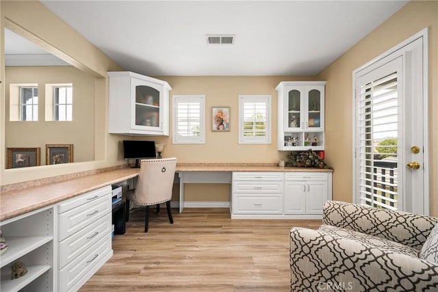 23725 Scarlet Oak Dr, Murrieta, CA 92562 - office area with built in study area, light wood-style floors, and baseboards