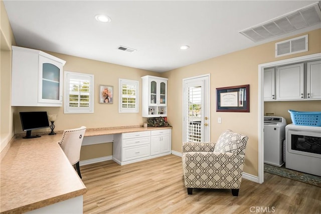 23725 Scarlet Oak Dr, Murrieta, CA 92562 - office featuring built in desk, light wood-style flooring, washing machine and clothes dryer, baseboards, and recessed lighting