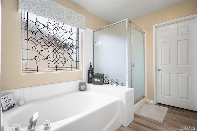 23725 Scarlet Oak Dr, Murrieta, CA 92562 - bathroom with wood finished floors, a bath, and a stall shower