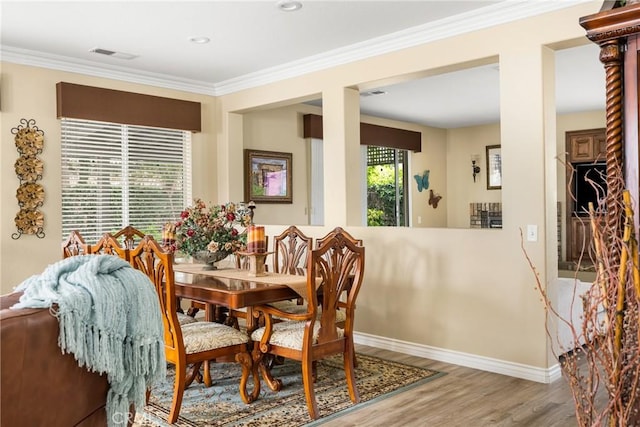 23725 Scarlet Oak Dr, Murrieta, CA 92562 - dining space with wood finished floors, baseboards, and crown molding