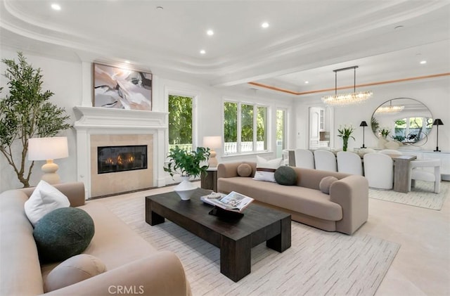 71 Ritz Cove Dr, Dana Point, CA 92629 - living area with a raised ceiling, recessed lighting, a tile fireplace, a chandelier, and ornamental molding