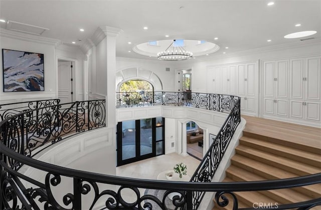 71 Ritz Cove Dr, Dana Point, CA 92629 - staircase featuring french doors, ornamental molding, recessed lighting, and a decorative wall